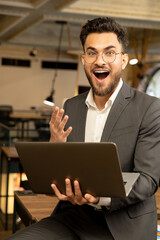 Young manager looking excited after receiving a good news