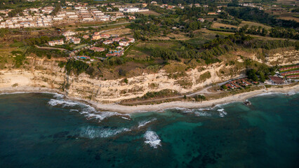 Obraz premium Luxury Cliffside Villas Overlooking a Turquoise Coastline – Southern Europe Aerial Perspective
