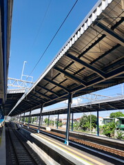 at the train station on a sunny day