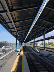 at the train station on a sunny day