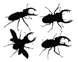 Set of horned beetle silhouettes.
