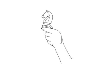 Hand holding chess knight in continuous one line drawing. Single line art illustration of hand holds chess piece.