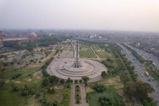 aerial view of Minar e Pakistan in Greater Iqbal Park, Lahore, Pakistan. Green spaces, monuments, and vibrant city skyline.
