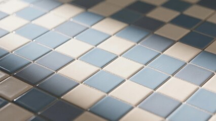 Close-up of a mosaic tile pattern featuring shades of blue and white squares