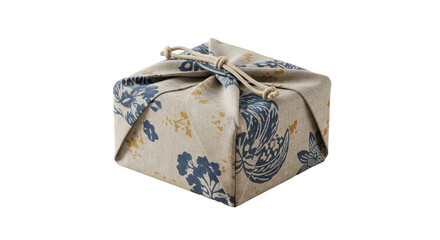 Decorative gift wrapped in fabric with floral print and tied bow  