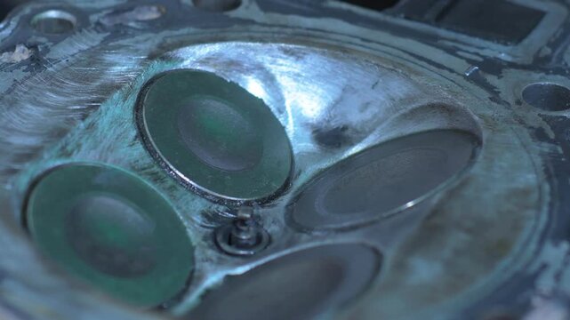 Detailed close-up of valves rotating and opening in a KLR motorcycle engine. This footage highlights the intricate mechanics involved in the maintenance process, showcasing precision and care.
