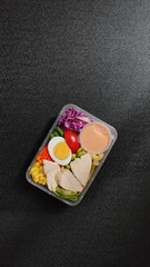 Suitable for food blogs, social media posts, and advertisements showcasing healthy eating habits and meal prep inspiration. Perfect for promoting fresh and convenient meal options.