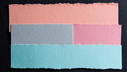 Fototapeta premium Overlapping rectangular paper scraps with torn edges. The colors include peach, gray, pink, and blue. A dark background creates contrast