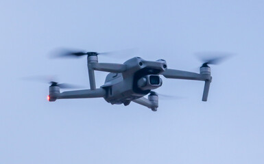 A drone is flying in the sky