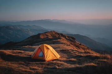 Orange tent on a grassy hilltop with stunning mountain range vista. Perfect for blogs about nature, travel, or outdoor adventure promotions.