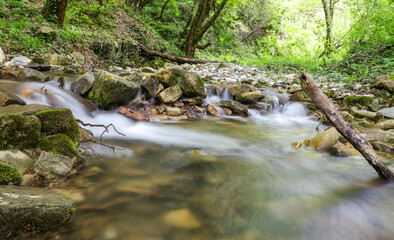 A stream of water flows through a rocky area