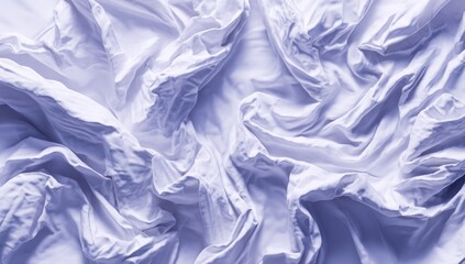 Obraz premium Crinkled, light-colored textile, possibly linen or cotton, fills the frame. Soft shadows create depth amidst the folds and wrinkles of the fabric, highlighting a sense of disorder and soft texture