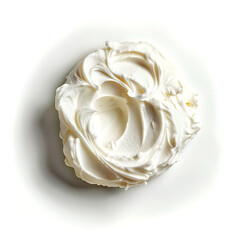 A swirl of whipped cream with a smooth, creamy texture on a white background