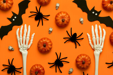 Top view of skeleton hand bones and Halloween party decoration. Halloween concept background