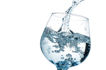 Clear water being poured into a wine glass isolated on transparent background.
