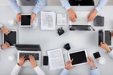 Team collaboration in a modern office with gadgets during a productive business meeting in the afternoon