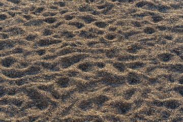 Sunrise  abstract Shapes on Sunlit Sandy Beach