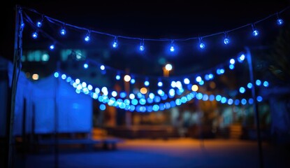 Out-of-focus blue string lights at night