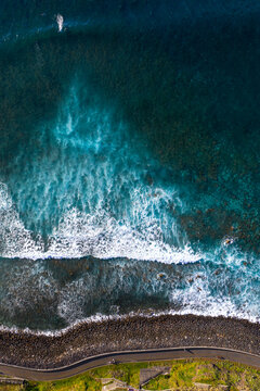 Surfer catching a wave aerial shot