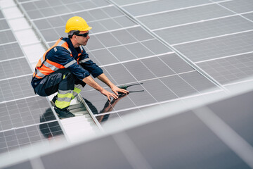 Worker adjusts solar panels on a rooftop, ensuring optimal positioning for energy efficiency during...