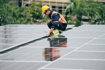 Technician installs solar panels on rooftop in urban setting during daylight hours