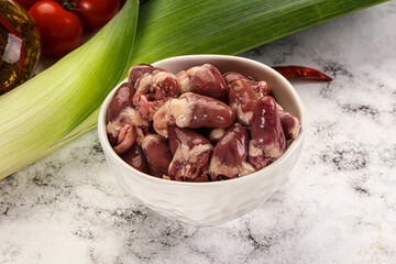 Raw chicken hearts in the bowl