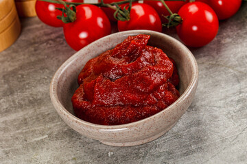 Red tomato paste in the bowl