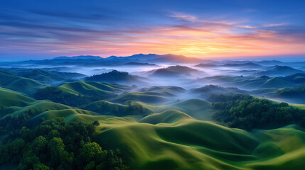 Aerial view of sunrise over rolling green hills covered in morning mist and golden light sunrise landscape, nature aerial, morning mist, scenic hills, peaceful nature
