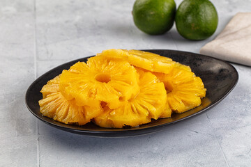 Sweet canned pineapple slices in syrope