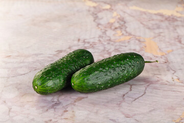 Ripe green raw two cucumbers