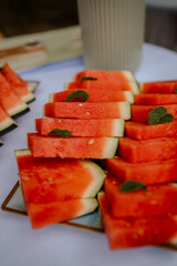 Photo of red, fresh, juicy watermelon slices served at the buffet &mdash; a burst of summer sweetness. 