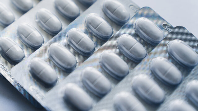 Medicine pill in blister packaging used in pharmacy and health care. Ideal of drug treatment, supplement or vitamin and pharmaceutical marketing. Healthcare and illness concept.