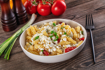 Italian pasta fusili with curd