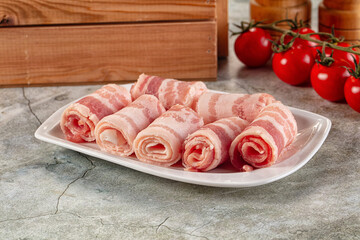 Raw bacon pork roll sliced
