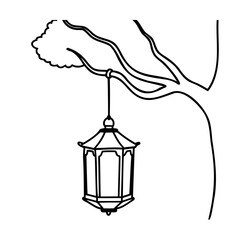 Ornate lantern hanging from tree branch outdoor