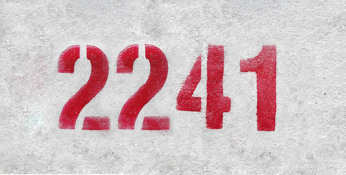Red Number 2241 on the white wall. Spray paint.