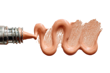 Light peach-toned cosmetic substance extruding from a metallic applicator