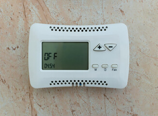 Climate control system control panel mounted on the wall in the off state