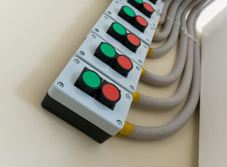 Control panel with 'Start' and 'Stop' buttons mounted on the wall
