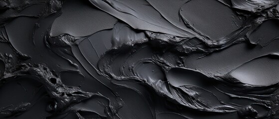 Dark black smooth texture dry cream brush stoke close up wallpaper abstract rough paint.