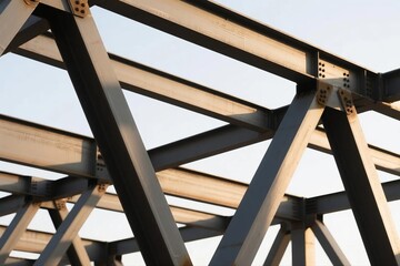 Geometric arrangement of industrial steel beams at a construction site, bathed in soft natural light.