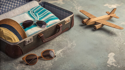 Travel Accessories for Beach Getaway in Vintage Suitcase