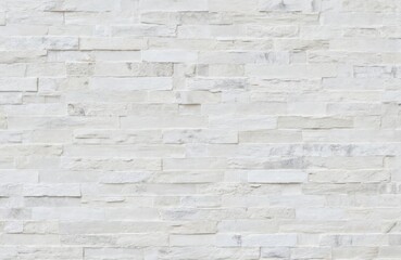 Fototapeta premium Close-up of white brick wall texture with gray grout lines. Brick pattern creates orderly, symmetrical composition. White bricks, gray grout add contrast, depth to image. Gray, white colors, brick,