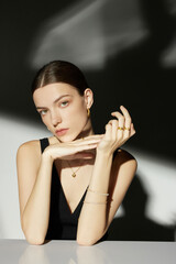 Young woman posing elegantly with jewelry.
