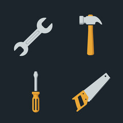 Four essential hand tools for construction and repair on a dark background