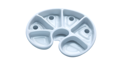 A white divided serving dish with multiple compartments and holes on a black background studio shot