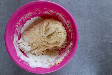 top view of kneaded dough in a mixing bowl