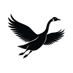 Obraz premium Elegant silhouette of a goose in flight with neck stretched for graceful movement