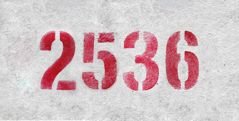 number 2536 . Red spray paint the white wall