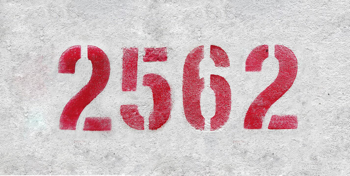 Red Number 2562 on the white wall. Spray paint.